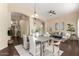 Bright living and dining area with modern decor, dark wood floors, and a neutral color palette at 20640 N 100Th Ln, Peoria, AZ 85382