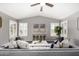 Inviting living room with vaulted ceiling, plentiful natural light, and open concept layout at 20640 N 100Th Ln, Peoria, AZ 85382