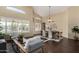 Living room and dining space with vaulted ceilings and large windows that flood the area with natural light at 20640 N 100Th Ln, Peoria, AZ 85382