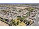 Aerial view of a residential area with well-maintained homes, landscaping, and community amenities, showcasing neighborhood layout at 21359 E Camacho Rd, Queen Creek, AZ 85142