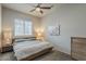 Bedroom featuring a ceiling fan, window, and neutral color scheme at 21359 E Camacho Rd, Queen Creek, AZ 85142