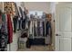 Walk-in closet with ample storage space and carpeted floors at 21359 E Camacho Rd, Queen Creek, AZ 85142