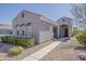 Beautiful home showcasing desert landscaping, a tiled roof, and an inviting covered entryway at 21359 E Camacho Rd, Queen Creek, AZ 85142