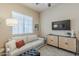 Cozy living room with plush seating, media cabinet, and neutral decor at 21359 E Camacho Rd, Queen Creek, AZ 85142