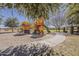 Community playground featuring colorful play structures, slides, and a sand pit for enjoyment at 21359 E Camacho Rd, Queen Creek, AZ 85142