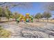 Community playground with climbing structures and slides, providing a fun and active space for children to play at 21359 E Camacho Rd, Queen Creek, AZ 85142