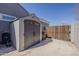 Durable outdoor storage shed with double doors and adjacent yard for additional storage needs at 21359 E Camacho Rd, Queen Creek, AZ 85142