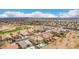 Beautiful aerial view of a residential community in Arizona near a golf course, showcasing stunning mountain views and clear blue skies at 21622 N Backus Dr, Maricopa, AZ 85138