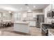 Bright kitchen area with stainless steel appliances and a cozy breakfast nook at 21622 N Backus Dr, Maricopa, AZ 85138