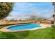 Beautiful pool area featuring lush landscaping and a sparkling pool, perfect for relaxation and outdoor fun at 21622 N Backus Dr, Maricopa, AZ 85138