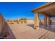 Spacious backyard with pavers, covered patio, block fence and view of mountains at 224 N 236Th Ave, Buckeye, AZ 85396