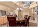 Formal dining room featuring an elegant chandelier and stylish furnishings and an airy feel at 224 N 236Th Ave, Buckeye, AZ 85396