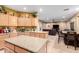 Open-concept kitchen that seamlessly connects to the living and dining area with abundant counter space at 224 N 236Th Ave, Buckeye, AZ 85396