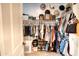 Spacious closet with ample storage racks, shelves, rods, shoes and clothing at 22474 E Lawndale E Pl, Queen Creek, AZ 85142