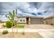 Lovely single-story home with a manicured front lawn, stylish front door, and a two-car garage at 22474 E Lawndale E Pl, Queen Creek, AZ 85142