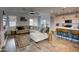 Bright living area with modern furniture flowing seamlessly into a well-equipped kitchen at 22474 E Lawndale E Pl, Queen Creek, AZ 85142