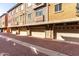 Exterior shot of townhome garages, offering a well-maintained appearance and convenient parking options at 240 W Juniper Ave # 1146, Gilbert, AZ 85233