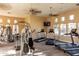 Community gym with treadmills, weight machines, and ceiling fans for a complete workout at 240 W Juniper Ave # 1146, Gilbert, AZ 85233