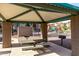 Community picnic area featuring shaded seating, BBQ grills, and nearby playground for residents at 240 W Juniper Ave # 1146, Gilbert, AZ 85233