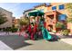 Community playground offers fun activities with a colorful play structure and safe rubber flooring at 240 W Juniper Ave # 1146, Gilbert, AZ 85233