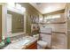 Bathroom featuring a shower, and stylish vanity with granite countertops at 2612 N 161St Ave, Goodyear, AZ 85395