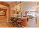 Stylish kitchen with granite countertops, a breakfast bar, and an adjacent dining area at 2612 N 161St Ave, Goodyear, AZ 85395