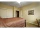 Bedroom featuring neutral carpeting, a ceiling fan, and a closet with sliding doors at 2662 S Springwood S Blvd # 458, Mesa, AZ 85209