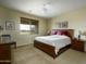 Comfortable main bedroom featuring a large window, ceiling fan, and neutral decor at 2662 S Springwood S Blvd # 458, Mesa, AZ 85209