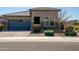 Charming single-story home with a blue garage door, neutral color scheme, and well-maintained landscaping at 2849 W Apollo Rd, Phoenix, AZ 85041