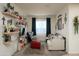 Comfortable living room with decorative shelves, a cozy couch and neutral color palette at 2849 W Apollo Rd, Phoenix, AZ 85041