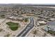 Panoramic aerial shot of a residential area featuring a roundabout and community green spaces at 2923 E Preston St, Mesa, AZ 85213