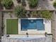 Aerial view of a private backyard featuring a sparkling pool, turf, and desert landscaping at 2923 E Preston St, Mesa, AZ 85213