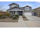 Charming two-story home featuring a well-manicured front yard and a two car garage at 2923 E Preston St, Mesa, AZ 85213