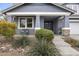 Inviting front entrance featuring a covered porch with stone accents and desert landscaping at 2923 E Preston St, Mesa, AZ 85213