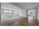 Bright, spacious living room featuring neutral paint, carpet, and a decorative chandelier at 2923 E Preston St, Mesa, AZ 85213