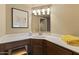 The bathroom has a vanity sink, a large mirror, and a towel at 3031 N Civic Center Plz # 339, Scottsdale, AZ 85251