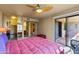 Bedroom featuring sliding door to the balcony, ceiling fan and mirrored closet at 3031 N Civic Center Plz # 339, Scottsdale, AZ 85251