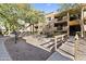 Condominium exterior featuring mature trees, landscaped grounds, walkways, and a bridge entry at 3031 N Civic Center Plz # 339, Scottsdale, AZ 85251