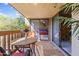 Cozy patio with a wooden table, chairs, and plants, leading to the bedroom at 3031 N Civic Center Plz # 339, Scottsdale, AZ 85251