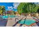 Community pool featuring mature landscaping, a hot tub and lounge chairs at 3031 N Civic Center Plz # 339, Scottsdale, AZ 85251