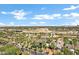 Expansive aerial view of the city featuring palm-lined streets, residential areas, and distant buildings, offering a scenic landscape at 348 W Portland St, Phoenix, AZ 85003