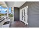 Covered balcony with a view, gray siding, white trim, and double doors for outdoor living at 348 W Portland St, Phoenix, AZ 85003