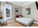 Cozy bedroom with wood floors, natural light, and minimalist decor creating a relaxing atmosphere at 348 W Portland St, Phoenix, AZ 85003