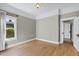 Bright and airy bedroom with hardwood floors and neutral walls, offering a blank canvas for personalization at 348 W Portland St, Phoenix, AZ 85003