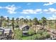 Beautiful two-story home featuring lush tropical landscaping, a charming balcony and welcoming porch at 348 W Portland St, Phoenix, AZ 85003