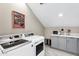 Modern laundry room with stainless steel washer and dryer, countertop, and cabinet storage at 348 W Portland St, Phoenix, AZ 85003