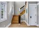 Staircase with wood steps, hardwood floors, and natural light through the bright windows at 348 W Portland St, Phoenix, AZ 85003