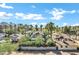 Charming street view showcases lush palm trees, well-maintained homes, and vibrant greenery, capturing the neighborhood's inviting atmosphere at 348 W Portland St, Phoenix, AZ 85003