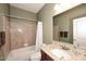 Cozy bathroom with a tub and shower combination and granite countertops at 3685 N 162Nd Ln, Goodyear, AZ 85395