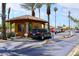 Gated community entrance with a security booth, landscaped surroundings, and controlled access at 3685 N 162Nd Ln, Goodyear, AZ 85395